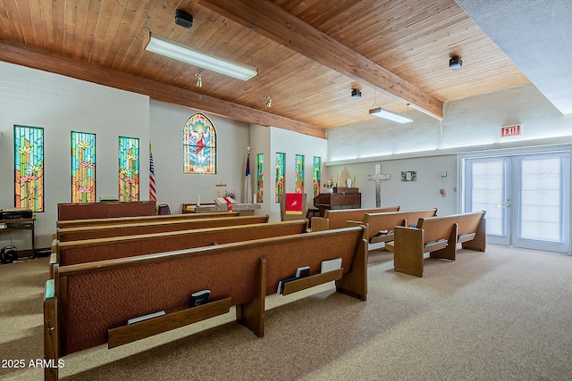 misc room featuring beam ceiling, french doors, wood ceiling, and carpet floors