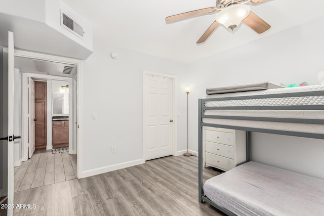 bedroom with ceiling fan and light wood-type flooring