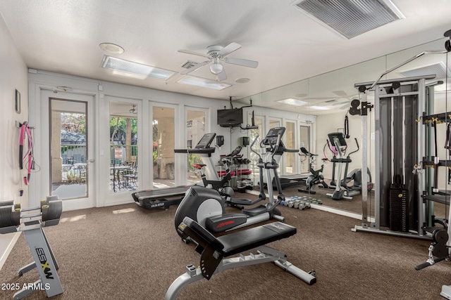 workout area featuring carpet flooring and ceiling fan