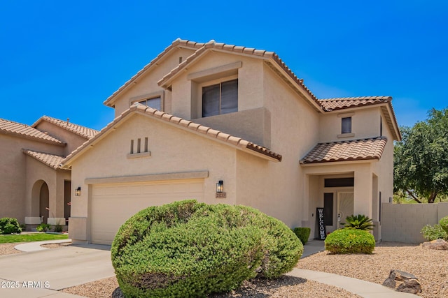 25210 N 40th Ave, Phoenix, AZ 85083 - mediterranean / spanish-style home featuring a tile roof, an attached garage, stucco siding, and concrete driveway