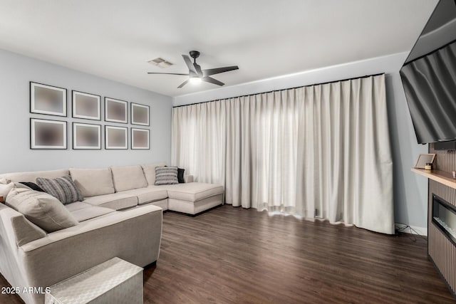 25210 N 40th Ave, Phoenix, AZ 85083 - living area with a ceiling fan, dark wood-style floors, and a glass covered fireplace
