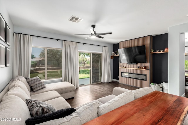 25210 N 40th Ave, Phoenix, AZ 85083 - living area with ceiling fan, wood finished floors, and a fireplace