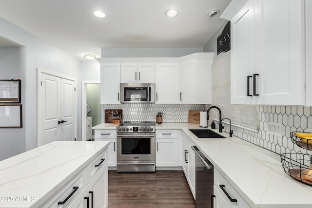 25210 N 40th Ave, Phoenix, AZ 85083 - kitchen featuring stainless steel appliances, light stone counters, backsplash, white cabinetry, and recessed lighting