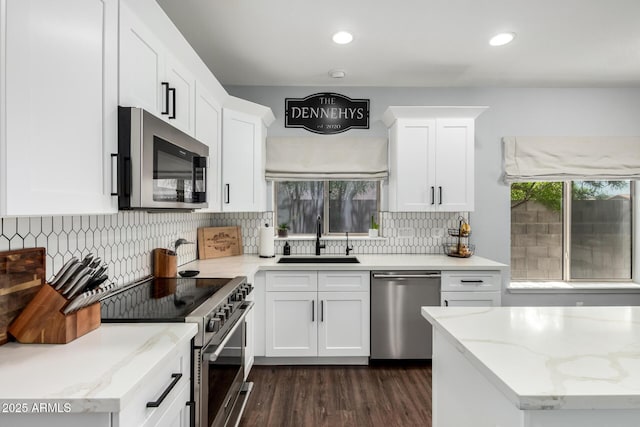 25210 N 40th Ave, Phoenix, AZ 85083 - kitchen featuring stainless steel appliances, decorative backsplash, white cabinetry, dark wood-type flooring, and recessed lighting
