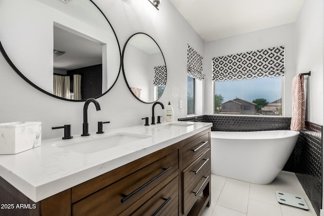 25210 N 40th Ave, Phoenix, AZ 85083 - bathroom with double vanity, a freestanding tub, and tile patterned flooring
