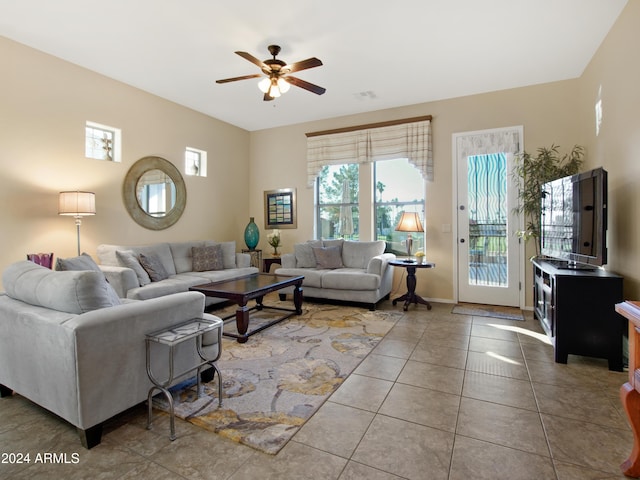 living room featuring tile patterned flooring and ceiling fan