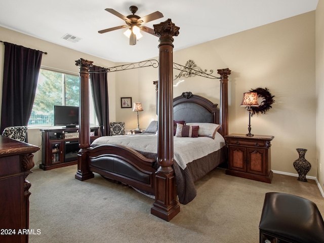 bedroom featuring light colored carpet and ceiling fan