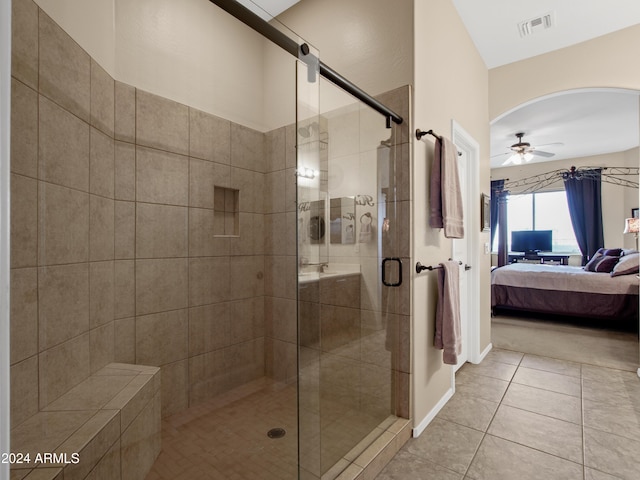 bathroom with ceiling fan, tile patterned floors, and walk in shower