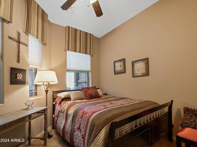 bedroom with light carpet and ceiling fan