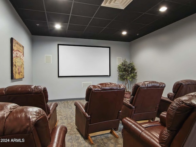 cinema featuring a paneled ceiling