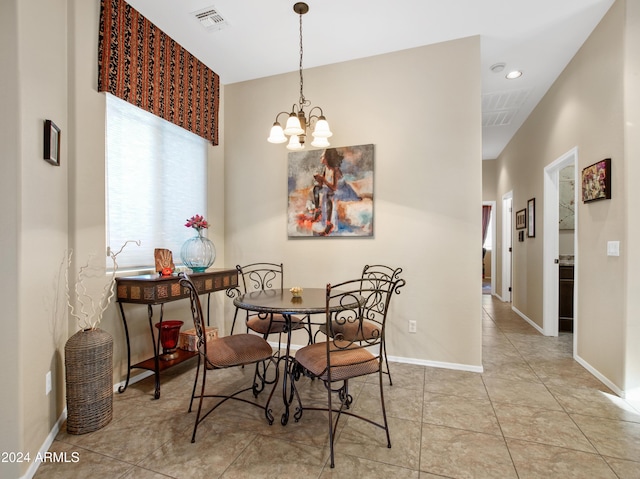 dining space featuring an inviting chandelier and light tile patterned floors