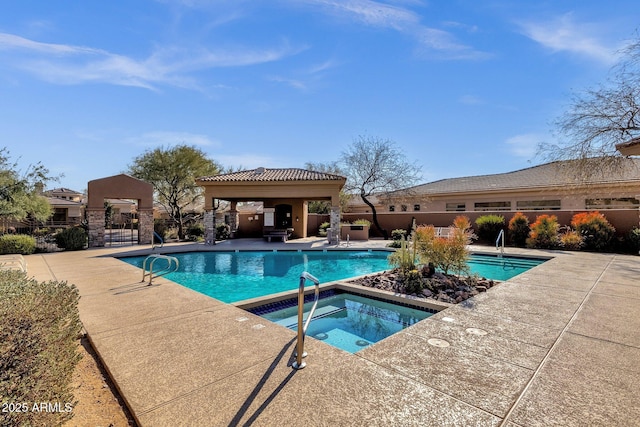 view of swimming pool with a gazebo, a patio area, and an in ground hot tub