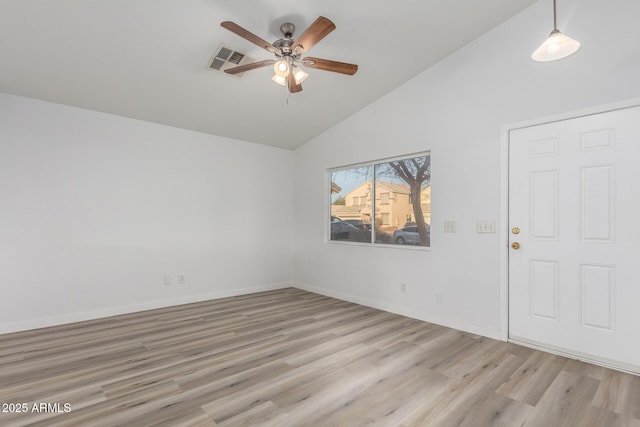 empty room featuring ceiling fan, high vaulted ceiling, and light hardwood / wood-style floors