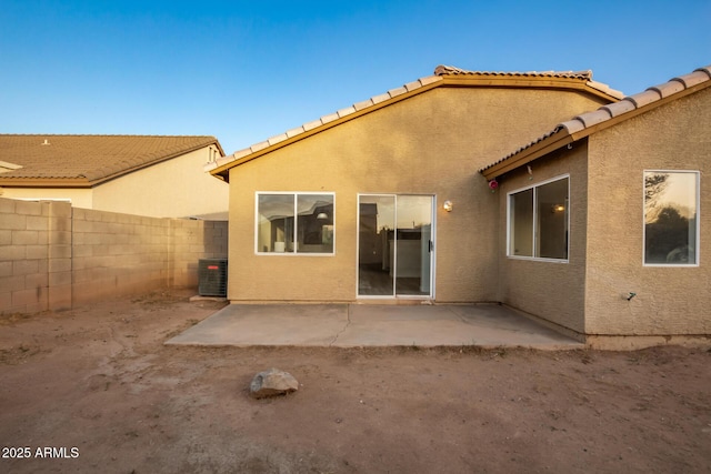 rear view of house featuring a patio and central AC unit