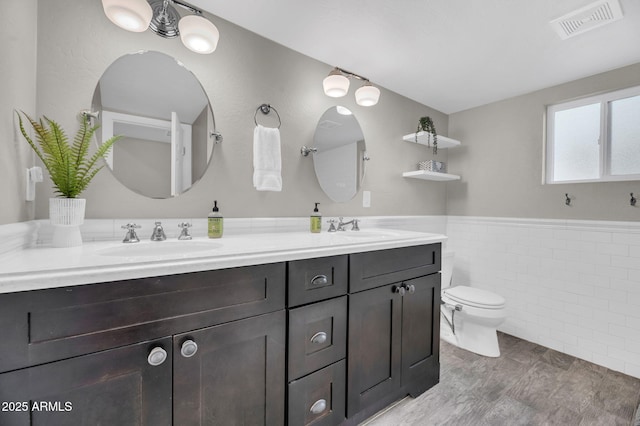 4020 N 34th St, Phoenix, AZ 85018 - bathroom featuring a sink, toilet, double vanity, and visible vents