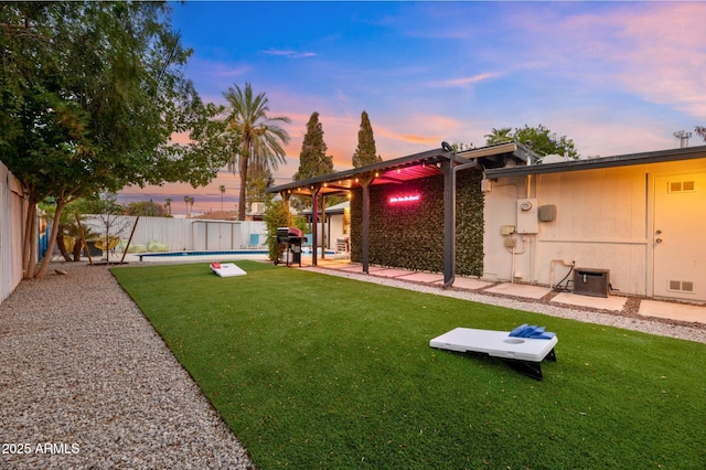 4020 N 34th St, Phoenix, AZ 85018 - yard at dusk featuring central air condition unit, a fenced in pool, a fenced backyard, and a patio area