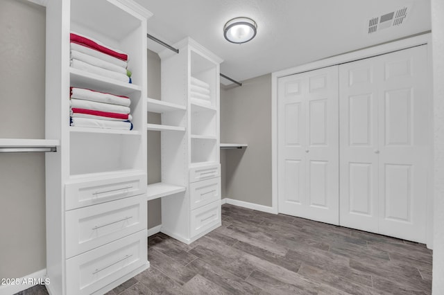 4020 N 34th St, Phoenix, AZ 85018 - spacious closet featuring dark wood-type flooring and visible vents