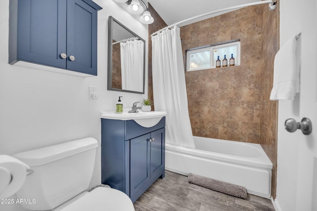4020 N 34th St, Phoenix, AZ 85018 - full bath featuring vanity, shower / bath combo, toilet, and wood finished floors