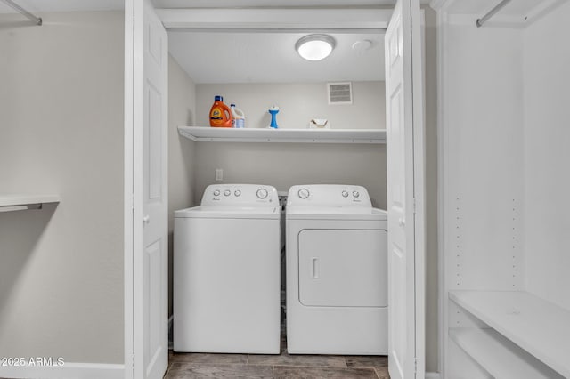 4020 N 34th St, Phoenix, AZ 85018 - washroom with separate washer and dryer, laundry area, wood finished floors, and visible vents