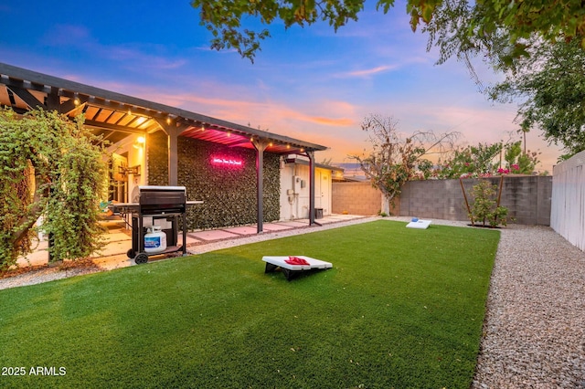 4020 N 34th St, Phoenix, AZ 85018 - yard at dusk with a fenced backyard and a patio