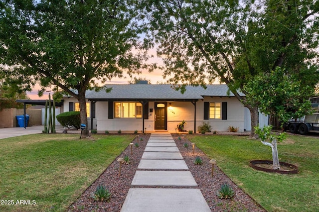 4020 N 34th St, Phoenix, AZ 85018 - ranch-style home with a shingled roof, a yard, an attached carport, and concrete driveway