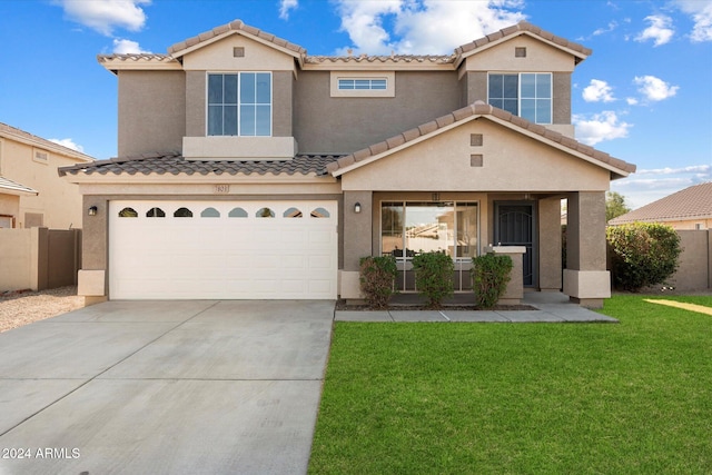 view of front of house featuring a garage and a front yard