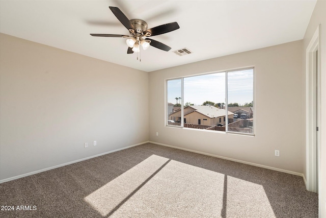 unfurnished room featuring carpet floors and ceiling fan