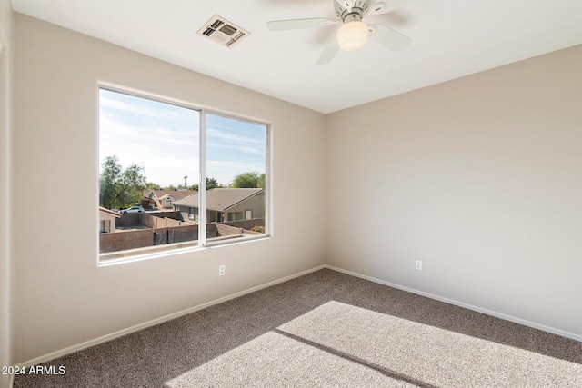 empty room with carpet flooring and ceiling fan