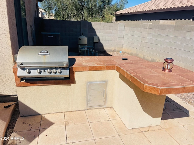 view of patio / terrace featuring area for grilling and an outdoor kitchen