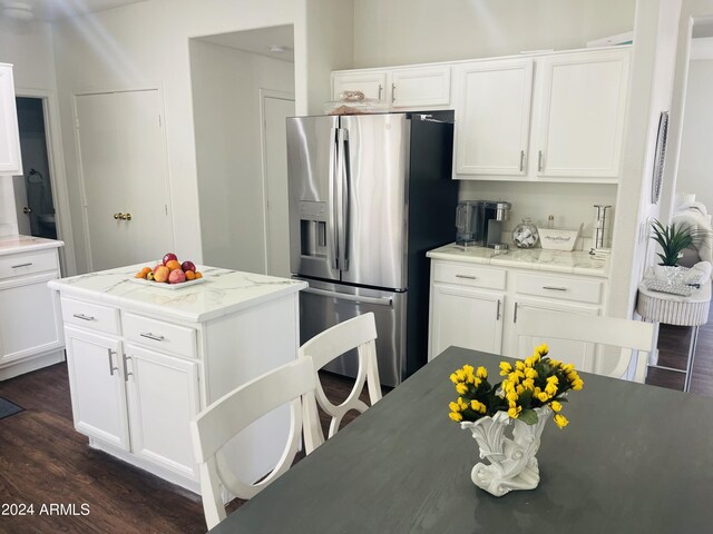 kitchen with dark hardwood / wood-style flooring, sink, stainless steel appliances, and white cabinets