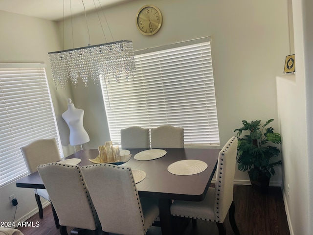 dining area with dark hardwood / wood-style floors