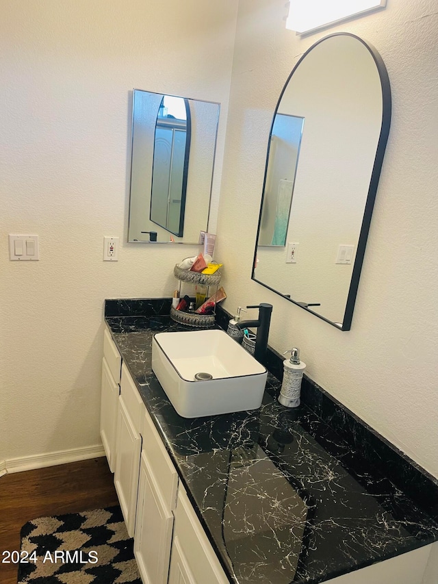 bathroom featuring wood-type flooring and vanity