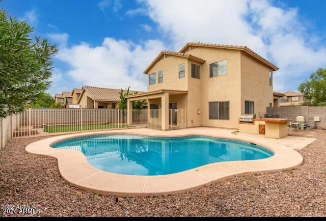 view of swimming pool with a patio area