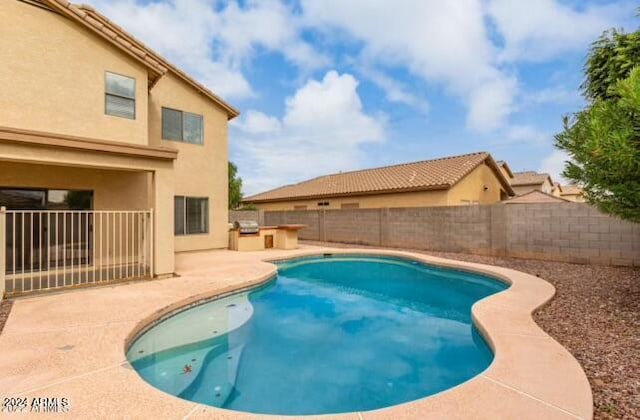 view of pool with a patio area