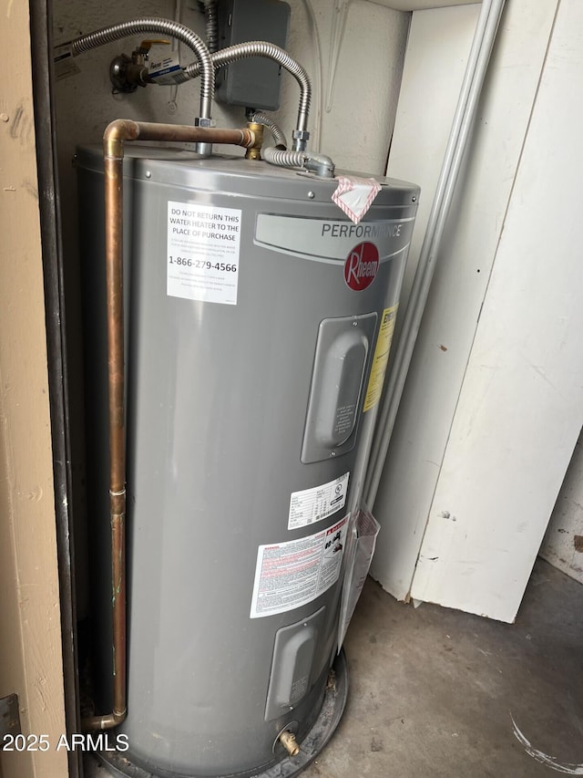 utility room with electric water heater