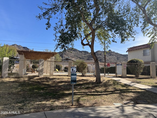 view of front facade featuring a mountain view and a pergola