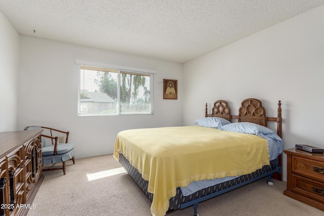 carpeted bedroom with a textured ceiling