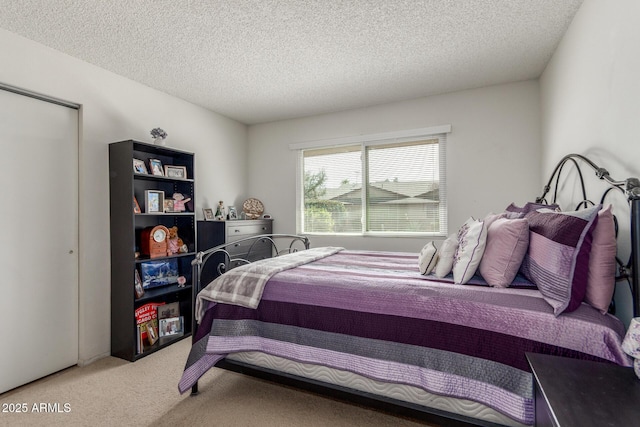 carpeted bedroom with a textured ceiling