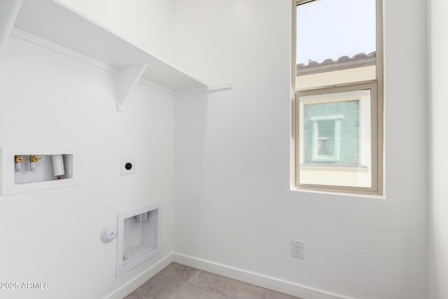 washroom featuring hookup for a washing machine, light tile patterned flooring, electric dryer hookup, laundry area, and baseboards