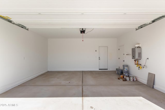 garage featuring a garage door opener, water heater, and baseboards