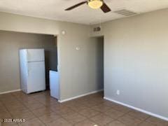 104 N Casa Grande Ave, Casa Grande, AZ 85122 - spare room with visible vents, tile patterned floors, a ceiling fan, and baseboards