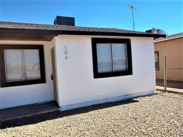 104 N Casa Grande Ave, Casa Grande, AZ 85122 - view of side of property featuring stucco siding and fence