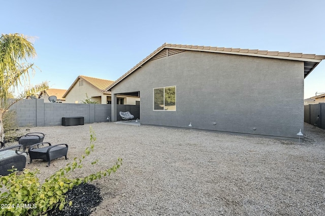 rear view of house with a patio