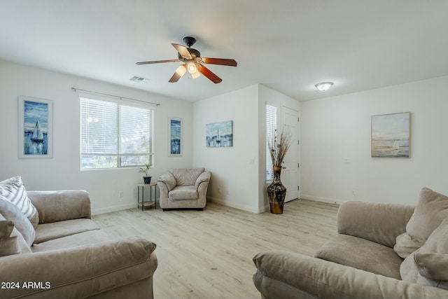 living room with ceiling fan and light hardwood / wood-style floors