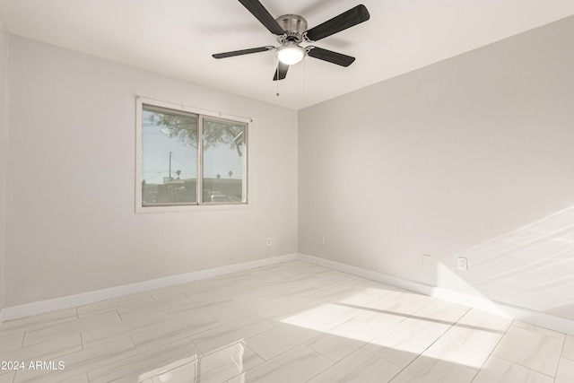 unfurnished room with ceiling fan