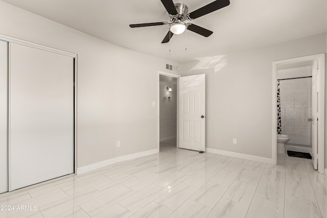 unfurnished bedroom featuring ceiling fan, a closet, and ensuite bath