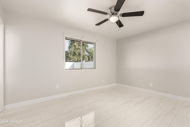 spare room featuring ceiling fan