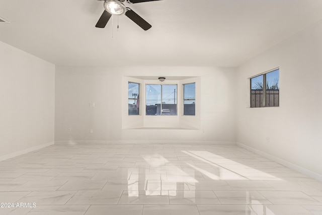 empty room featuring ceiling fan