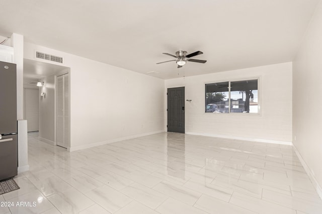 unfurnished room with ceiling fan