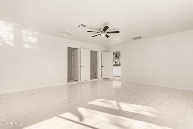 spare room featuring ceiling fan